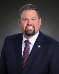 J. Adam Bass